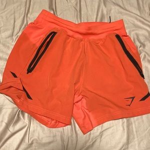 Gymshark- Apex 5” Perform Shorts, Size Mens Small, Orange Color